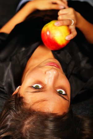 beautiful girl with ripe appleの写真素材