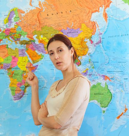 teacher in classroom before a  mapの写真素材
