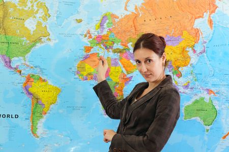 teacher in classroom before a  mapの写真素材