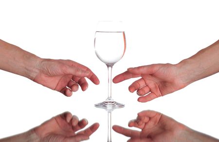 two hands and glass with waterの写真素材