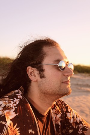 men on seacoast before a sunset.の写真素材