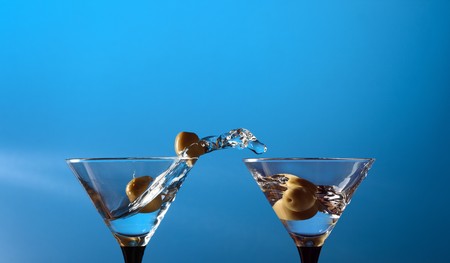 wineglasses  with martini and green olivesの写真素材