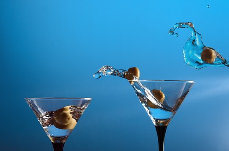 wineglasses  with martini and green olivesの写真素材