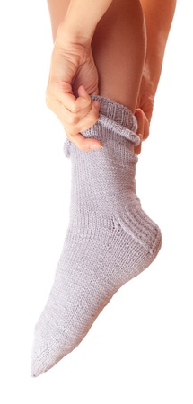 woman leg in woollen sock .の写真素材