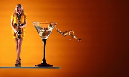 martini and  woman in yellow dress with saxophone.の写真素材