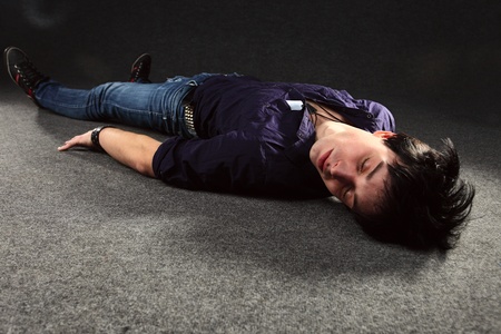 The young man on a floor.の写真素材