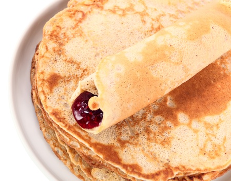 pancakes and raspberry jam ,isolated on a white background,saved clipping path.