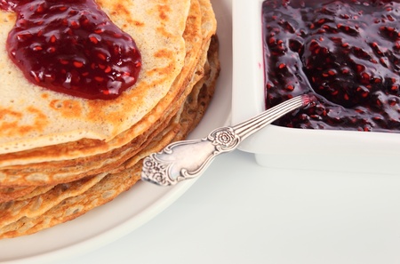 pancakes ,raspberry confiture and silver spoon.
の写真素材