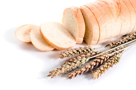 Bread and cereal ears on a white background.の写真素材