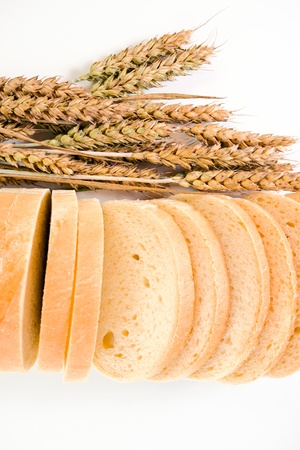 Bread and cereal ears on a white background.の写真素材
