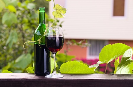 bottle and glass with red wine.の写真素材