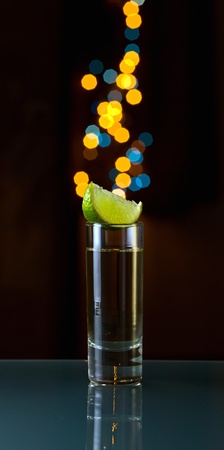 tequila and lime on a glass table.の写真素材