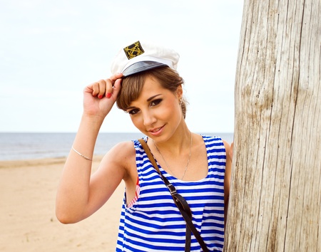 The young beautiful girl on a beach.の写真素材