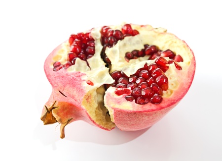 ripe red pomegranate on a white background.の写真素材