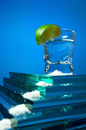 tequila and lime on a glass pyramid.の写真素材
