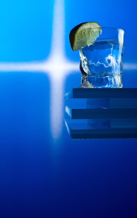 tequila and lime on a glass table.の写真素材