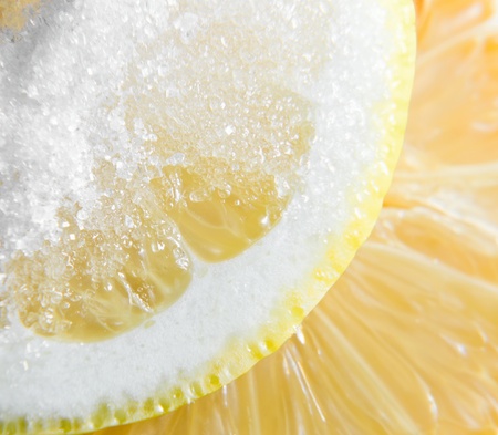 Ripe lemon with sugar, focus on a center.の写真素材