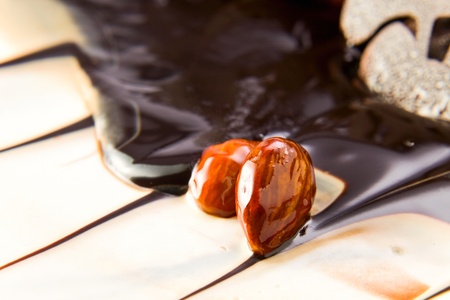 Chocolate pie with almonds,focus on a nuts.の写真素材