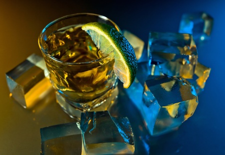 tequila , lime and ice on a glass table.の写真素材