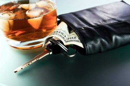Whisky,money and key from car.の写真素材