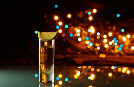 tequila and lime on a glass table.の写真素材