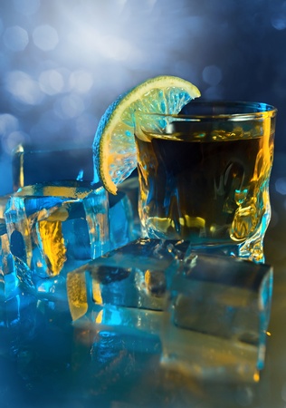 tequila , lime and ice on a glass table.の写真素材