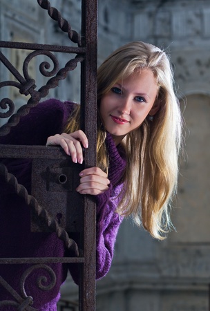 The young blond woman in an old building.の写真素材