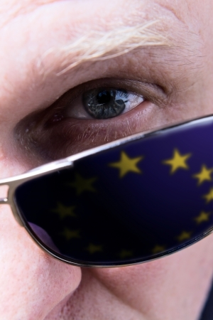 The person in the dark glasses, attentively looking at you . Saved clipping path of reflection in sunglasses.の写真素材