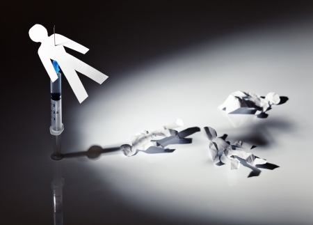 The conceptual image on a theme of narcotic dependence, a white reflective background.
の写真素材