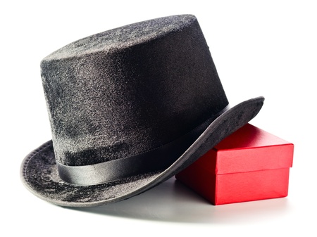 Black top hat and gift box isolated on white background 