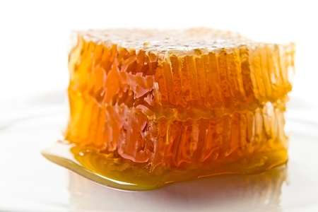 sweet honeycomb with honey , macro shot , focus on a foreground  の写真素材