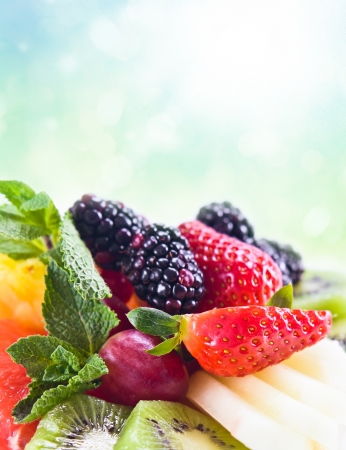 Fresh fruit with mint , focus on a strawberryの写真素材