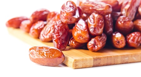 Dried dates isolated on a white backgroundの写真素材