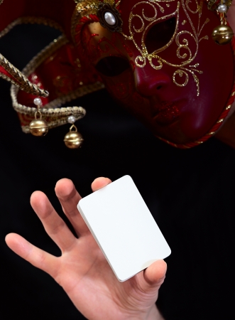 jokerin in mask with white cardの写真素材