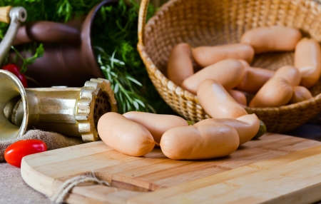 smoked sausage , rosemary and old meat grinderの写真素材