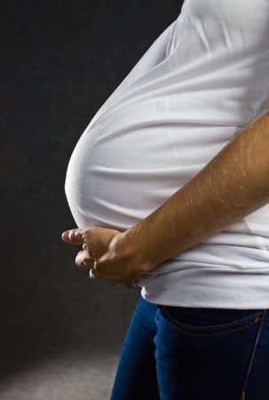Pregnant woman holding her bellyの写真素材