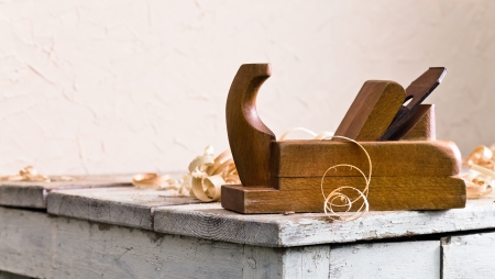 old wooden plane in a workshop of the carpenterの写真素材