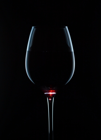  glass with red wine on a black backgroundの写真素材