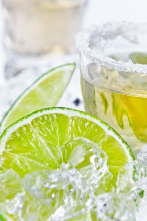 gold tequila with salt and lime on a ice.の写真素材
