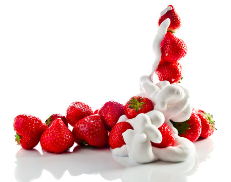 strawberry  with cream isolated on white reflexive の写真素材
