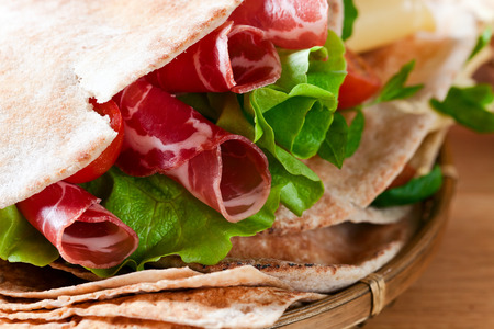 unleavened wheat cake  with smoked meat and greens の写真素材