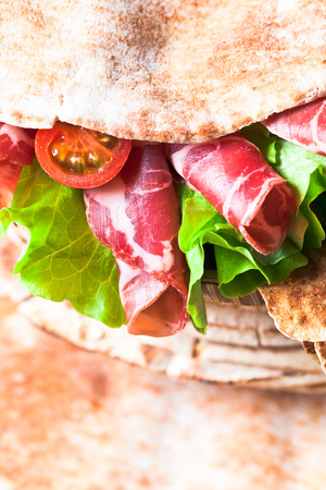 unleavened wheat cake with smoked meat and greens の写真素材