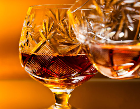 shot of a cut crystal glass containing brandy. の写真素材