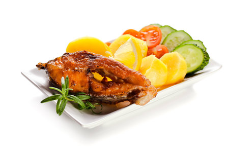 fried fish with lemon and boiled potato 