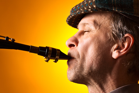 Portrait of the man playing a saxophoneの写真素材