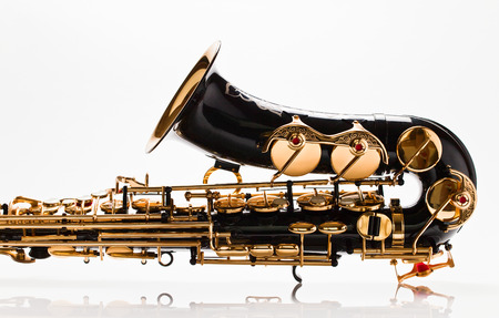 closeup of saxophone on white reflexive backgroundの写真素材