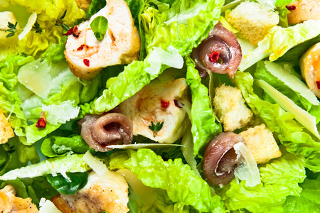Caesar salad with grilled chicken fillet and greensの写真素材