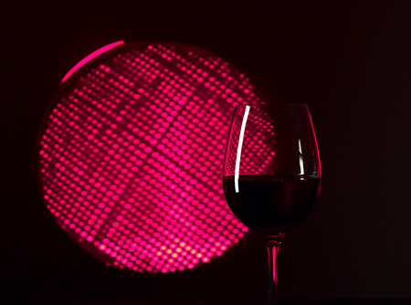  glass with pink  wine on dark backgroundの写真素材
