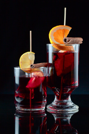 mulled wine with cinnamon on a black backgroundの写真素材