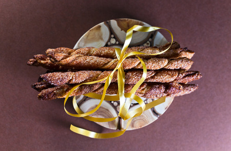 cookies with cinnamon on a brown background